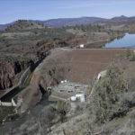 
              FILE - The Iron Gate Dam, powerhouse and spillway is seen on the lower Klamath River near Hornbrook, Calif, on March 3, 2020. The largest dam demolition and river restoration plan in the world could be close to reality Thursday, Nov. 17, 2022, as U.S. regulators vote on a plan to remove four aging hydro-electric structures, reopening hundreds of miles of California river habitat to imperiled salmon. (AP Photo/Gillian Flaccus, File)
            