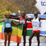 
              From left, women's division third place finisher Gotytom Gebreslase, of Ethiopia, winner Sharon Lokedi, of Kenya, and second place finisher Lonah Chemtai Salpeter, of Israel, pose at the finish line of the New York City Marathon, Sunday, Nov. 6, 2022, in New York. (AP Photo/Jason DeCrow)
            