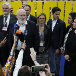 
              Frans Timmermans, executive vice president of the European Commission, center left, speaks to members of the media as German Foreign Minister Annalena Baerbock, right, listens at the COP27 U.N. Climate Summit, Saturday, Nov. 19, 2022, in Sharm el-Sheikh, Egypt. (AP Photo/Peter Dejong)
            
