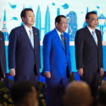 
              FILE - Left to right; Japan's Prime Minister Fumio Kishida, South Korea's President Yoon Suk Yeol, Cambodia Prime Minister Hun Sen, Chinese's Premier Li Keqiang and Indonesia's President Joko Widodo stand for group photo of the ASEAN Plus Three Summit (Association of Southeast Asian Nations) in Phnom Penh, Cambodia, Saturday, Nov. 12, 2022. Hun Sen said Tuesday, Nov. 15, 2022, he has tested positive for COVID-19 at the Group of 20 meetings in Bali, just days after hosting many world leaders, including President Joe Biden, for a summit in Phnom Penh. (AP Photo/Vincent Thian, File)
            