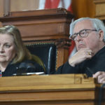 Kentucky Supreme Court Chief Justice John D. Minton Jr., right, and Justice Lisabeth Hughes listen to arguments whether to temporarily pause the state's abortion ban in Frankfort, Ky., Tuesday, Nov. 15, 2022. (AP Photo/Timothy D. Easley)