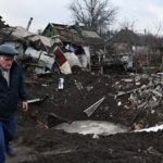 
              A man walks near a crater and his house that was damaged after Russian shelling in Kramatorsk, Ukraine, Saturday, Nov. 19, 2022. (AP Photo/Andriy Andriyenko)
            