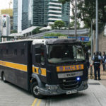
              A prison van believed to be carrying democracy advocate and Apple Daily founder Jimmy Lai arrives at the High Court in Hong Kong, Thursday, Dec. 1, 2022. The trial of Lai, who was arrested in a crackdown on a pro-democracy movement, was postponed Thursday after the territory's leader asked China to effectively block him from hiring a British defense lawyer. (AP Photo/Anthony Kwan)
            