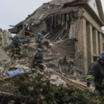 
              Ukrainian firefighters work at a damaged hospital maternity ward in Vilniansk, Zaporizhzhia region, Ukraine, Wednesday, Nov. 23, 2022. A Russian rocket struck the maternity wing of a hospital in eastern Ukraine on Wednesday, killing a newborn boy and critically injuring a doctor. The overnight explosion left the small-town hospital a crumbled mess of bricks, scattering medical supplies across the small compound. (AP Photo/Kateryna Klochko)
            