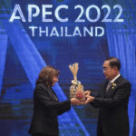 
              U.S. Vice President Kamala Harris, left, and Thailand's Prime Minister Prayuth Chan-ocha hold a Chalom, a bamboo basket symbolizing the "handing over of the baton", as the U.S. is the next summit host during the closing of the Asia-Pacific Economic Cooperation, APEC summit, Saturday, Nov. 19, 2022, in Bangkok, Thailand. (Haiyun Jiang/The New York Times via AP, Pool)
            