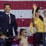 
              Incumbent Florida Republican Gov. Ron DeSantis, his wife Casey and their children on stage after speaking to supporters at an election night party after winning his race for reelection in Tampa, Fla., Tuesday, Nov. 8, 2022. (AP Photo/Rebecca Blackwell)
            