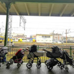 
              FILE - Strollers for refugees and their babies fleeing the conflict from neighbouring Ukraine are left at the train station in Przemysl, Poland, Wednesday, March 2, 2022. Since the invasion of Ukraine more than eight months ago, Poland has aided the neighboring country and millions of its refugees — both to ease their suffering and to help guard against the war spilling into the rest of Europe. But a missile strike that killed two men Tuesday, Nov. 15 in a Polish village close to the Ukrainian border brought the conflict home and added to the long-suppressed sense of vulnerability in a country where the ravages of World War II are well remembered.  (AP Photo/Francesco Malavolta, File)
            