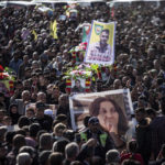 
              Syrian Kurds attend a funeral of people killed in Turkish airstrikes in the village of Al Malikiyah , northern Syria, Monday, Nov. 21, 2022. The airstrikes, which Turkey said were aimed at Kurdish militants whom Ankara blamed for a deadly Nov. 13 bombing in Istanbul, also struck several Syrian army positions in three different provinces along the border with Turkey. (AP Photo/Baderkhan Ahmad)
            