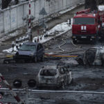 
              A firefighter walks in front of destroyed cars after Russian rocket attack in Kyiv, Ukraine, Wednesday, Nov. 23, 2022. (AP Photo/Evgeniy Maloletka)
            