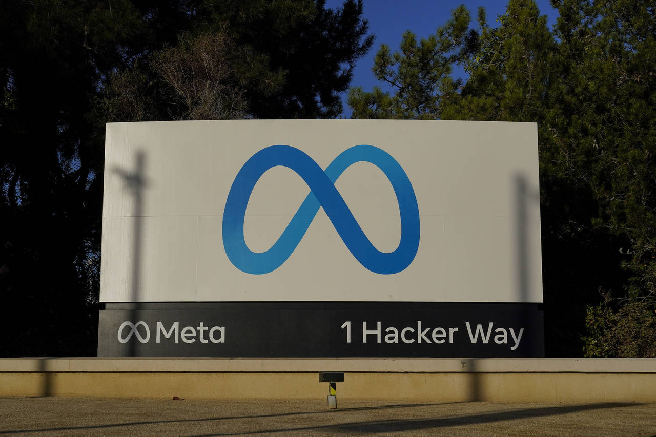 FILE - Meta's logo can be seen on a sign at the company's headquarters in Menlo Park, Calif., on No...