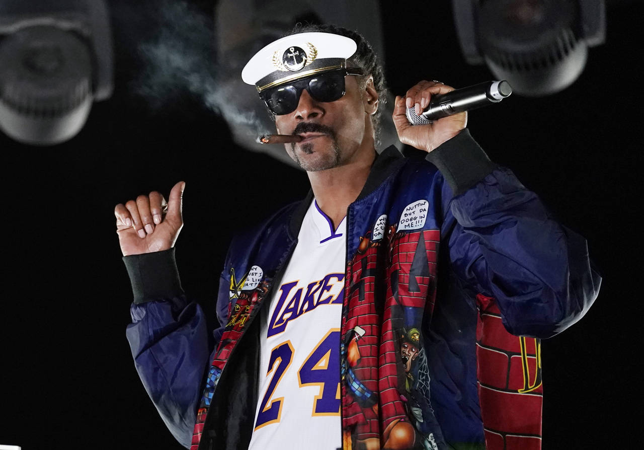 FILE - Snoop Dogg performs a DJ set as "DJ Snoopadelic" during the "Concerts In Your Car" series on...
