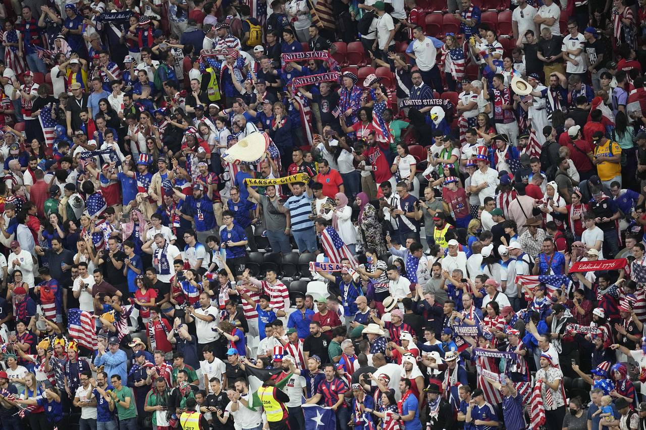 Fans from the United States cheer for their team during the World Cup group B soccer match between ...