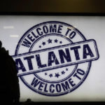 
              A traveller waits to board a flight at Hartsfield-Jackson Atlanta International Airport in Atlanta, Tuesday, Nov. 22, 2022. (AP Photo/Brynn Anderson)
            