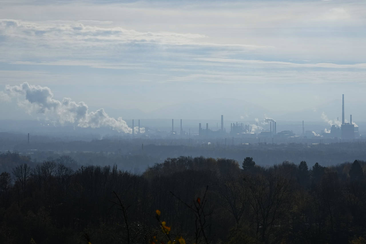 Smoke rises form chimneys of a steel plant in Ostrava, Czech Republic, Friday, Nov. 11, 2022. High ...