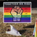 
              A sign stands at a makeshift memorial near the scene of a mass shooting at a gay nightclub Wednesday, Nov. 23, 2022, in Colorado Springs, Colo.  The alleged shooter facing possible hate crime charges in the fatal shooting of five people at a Colorado Springs gay nightclub is scheduled to make their first court appearance Wednesday from jail after being released from the hospital a day earlier.  (AP Photo/David Zalubowski)
            