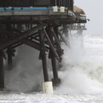 
              Waves break on the Cocoa Beach Pier as Tropical Storm Nicole makes its presence felt Wednesday, Nov. 9, 2022 in Cocoa Beach, Fla. Tropical Storm Nicole forced people from their homes in the Bahamas and threatened to grow into a rare November hurricane in Florida on Wednesday, shutting down theme parks and airports while prompting evacuation orders that included former President Donald Trump's Mar-a-Lago club.(Ricardo Ramirez/Orlando Sentinel via AP)
            