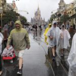
              Guests leave the Magic Kingdom at Walt Disney World in Lake Buena Vista, Fla., Wednesday, Nov. 9, 2022, as conditions deteriorate with the approach of Hurricane Nicole. All 4 Disney parks in Central Florida closed early Wednesday because of the impending storm. (Joe Burbank/Orlando Sentinel via AP)
            