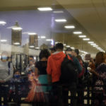 
              Travellers wait to go through security at the Hartsfield-Jackson Atlanta Airport in Atlanta, Tuesday, Nov. 22, 2022. (AP Photo/Brynn Anderson)
            