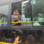 
              A man looks out from a bus window as people look for their family members and relatives on a bus carrying prisoners who released from Insein Prison Thursday, Nov. 17, 2022, in Yangon, 2022, in Yangon, Myanmar. The country's military-controlled government announced Thursday it was releasing and deporting an Australian academic, a Japanese filmmaker, an ex-British diplomat and an American as part of a broad prisoner amnesty to mark the country’s National Victory Day. (AP Photo)
            
