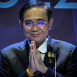 
              Thailand's Prime Minister Prayuth Chan-ocha offers the traditional Thai greetings gesture as addresses a press conference during the Asia-Pacific Economic Cooperation, APEC summit, Saturday, Nov. 19, 2022, in Bangkok, Thailand. (AP Photo/Anupam Nath)
            