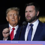 
              Ohio Senate candidate JD Vance speaks as former President Donald Trump listens at a campaign rally at Wright Bros. Aero Inc. at Dayton International Airport on Monday, Nov. 7, 2022, in Vandalia, Ohio. (AP Photo/Michael Conroy)
            