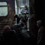 
              Ukrainians board the Kherson-Kyiv train at the Kherson railway station, southern Ukraine, Monday, Nov. 21, 2022. Ukrainian authorities are evacuating civilians from recently liberated sections of the Kherson and Mykolaiv regions, fearing that a lack of heat, power and water due to Russian shelling will make conditions too unlivable this winter. The move came as rolling blackouts on Monday plagued most of the country. (AP Photo/Bernat Armangue)
            