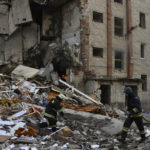 
              Firefighters work at the scene of a damaged residential building after Russian shelling in the liberated Lyman, Donetsk region, Ukraine, Monday, Nov. 7, 2022. (AP Photo/Andriy Andriyenko)
            