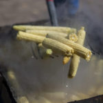 
              Farmer Eugene “Hutch” Naranjo boils corn at his home in Ohkay Owingeh, formerly named San Juan Pueblo, in northern New Mexico, Sunday, Aug. 21, 2022. Friends and relatives of the Naranjos gather every year to make chicos, dried kernels used in stews and puddings. (AP Photo/Andres Leighton)
            