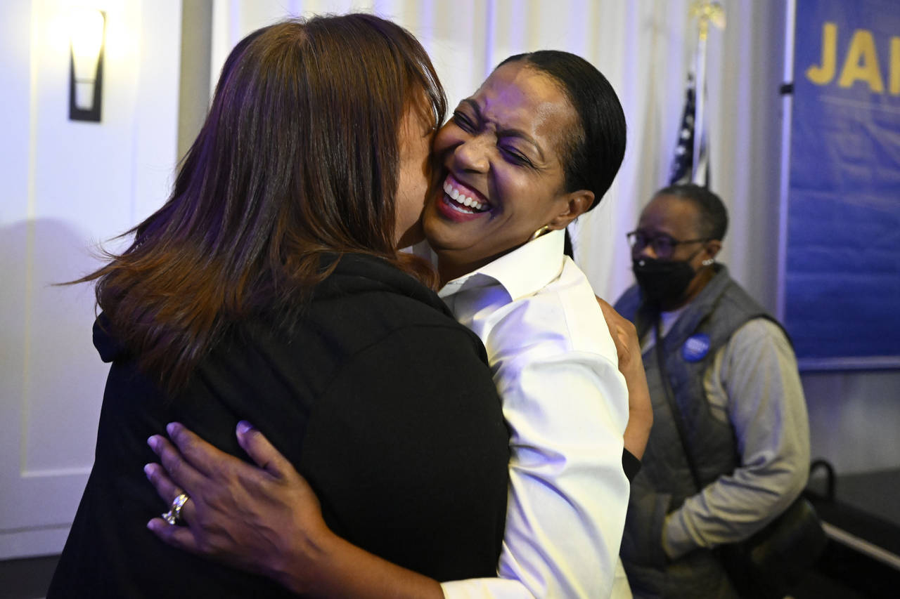 United States Rep. Jahana Hayes, D-Conn., front right, is embraced by a supporter at her election n...
