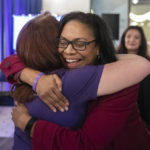 
              Supporters hug at a watch party for Michigan Proposal 3 at the David Whitney Building in Detroit on Election Day, Tuesday, Nov. 8, 2022.  Abortion rights supporters won in the four states where access was on the ballot Tuesday, as voters enshrined it into the state constitution in battleground Michigan as well as blue California and Vermont and dealt a defeat to an anti-abortion measure in deep-red Kentucky.  (Ryan Sun/Ann Arbor News via AP)
            