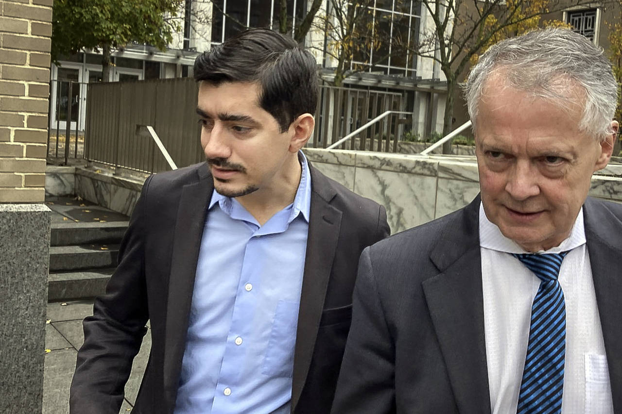 Michael DiMassa, left, and his lawyer, John Gulash, leave federal court, Tuesday, Nov. 1, 2022, in ...