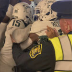 
              FILE - Security and police break up a scuffle between players from Michigan and Michigan State football teams in the Michigan Stadium tunnel after an NCAA college football game on Oct. 29, 2022 in Ann Arbor, Mich. Seven Michigan State football players were charged in the postgame melee in Michigan Stadium's tunnel last month, according to a statement Wednesday, Nov. 23, from the Washtenaw County Prosecutor's Office. (Kyle Austin/MLive Media Group via AP, File)
            