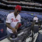 
              Everett DJ Hollywood plays music before Game 3 of baseball's World Series between the Houston Astros and the Philadelphia Phillies on Tuesday, Nov. 1, 2022, in Philadelphia. (AP Photo/David J. Phillip)
            