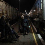 
              Ukrainians board the Kherson-Kyiv train at the Kherson railway station, southern Ukraine, Monday, Nov. 21, 2022. Ukrainian authorities are evacuating civilians from recently liberated sections of the Kherson and Mykolaiv regions, fearing that a lack of heat, power and water due to Russian shelling will make conditions too unlivable this winter. The move came as rolling blackouts on Monday plagued most of the country. (AP Photo/Bernat Armangue)
            