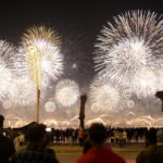 
              Fans watch fireworks after the World Cup inauguration match between Qatar and Ecuador at the Corniche sea promenade in Doha, Qatar, Sunday, Nov. 20, 2022. (AP Photo/Francisco Seco)
            