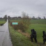 
              Polish police officers search for missile wreckage in the field, near the place where a missile struck, killing two people in a farmland at the Polish village of Przewodow, near the border with Ukraine, Wednesday, Nov. 16, 2022. (AP Photo/Evgeniy Maloletka)
            