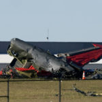 Debris from two planes that crashed during an airshow at Dallas Executive Airport are shown in Dallas on Saturday, Nov. 12, 2022. (AP Photo/LM Otero)