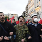 
              Protestors march as they shoot slogans during a rally, in Athens, Thursday, Nov. 17, 2022. Around 5,000 police were expected to be deployed in the Greek capital, where major streets were to be blocked to traffic and three subway stations along the march route shut down afternoon. In 1973, the military regime that had been in power since 1967 sent police and troops to crush student-led pro-democracy protests centered in the Athens Polytechnic. (AP Photo/Michael Varaklas)
            
