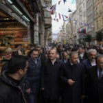 
              Turkey's Interior Minister Suleyman Soylu, center, visits the scene of Sunday's explosion on Istanbul's popular pedestrian Istiklal Avenue in Istanbul, Monday, Nov. 14, 2022. Turkey's interior minister says police have detained a suspect who is believed to have planted the bomb that exploded on a bustling pedestrian avenue in Istanbul. He said Monday that initial findings indicate that Kurdish militants were responsible for the attack. (AP Photo/Khalil Hamra)
            
