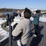 
              Visitors try to look toward the North side at the Imjingak Pavilion in Paju, South Korea, Friday, Nov. 4, 2022. North Korea fired at least six missiles into the sea on Thursday, including an intercontinental ballistic missile that triggered evacuation warnings and halted trains in northern Japan, adding to a recent barrage of weapons tests that has escalated tensions in the region. (AP Photo/Lee Jin-man)
            