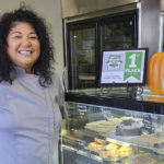 
              Maria Short poses in her bakery, Short 'N Sweet, in Hilo, Hawaii on Nov. 8, 2022. Higher prices are hitting everyone this holiday, but food vendors are seeing some of the biggest increases. (Maria Short via AP)
            