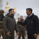 
              In this photo provided by the Ukrainian Presidential Press Office, Ukrainian President Volodymyr Zelenskyy, left, and British Prime Minister Rishi Sunak talk as they observe destroyed Russian military vehicles installed in downtown Kyiv, Ukraine, Saturday, Nov. 19, 2022. (Ukrainian Presidential Press Office via AP)
            