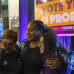 
              Supporters react as preliminary results come in for Michigan Proposal 3, which would in Detroit, Mich., on Election Day, Tuesday, Nov. 8, 2022. The ballot initiative would put a definitive end to a 1931 ban on abortion and affirm the right to make pregnancy-related decisions about abortion and other reproductive services such as birth control without interference. (Ryan Sun/Ann Arbor News via AP)
            