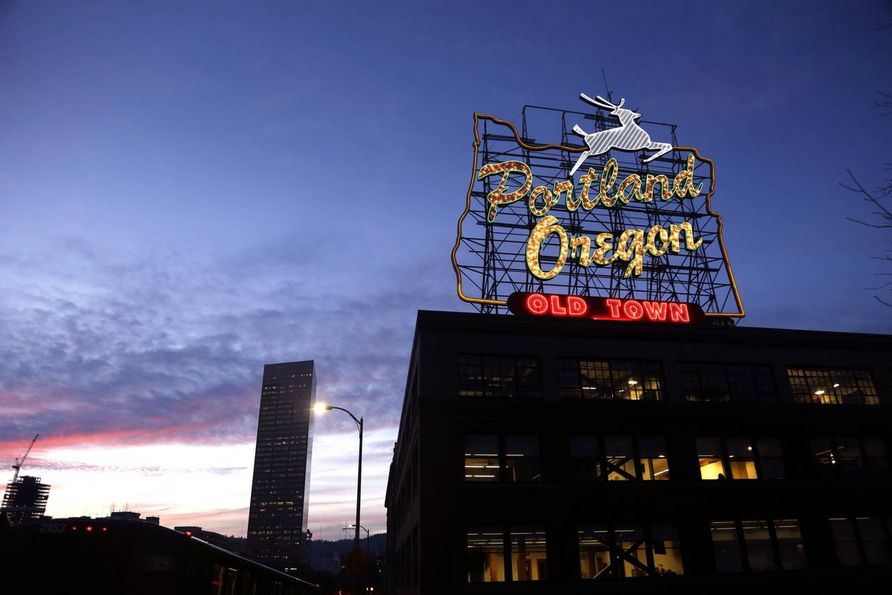 FILE - The "Portland, Oregon" sign is seen atop in building in downtown Portland, Ore., on Jan. 27,...