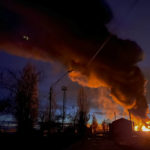 
              A plume of smoke rises during a fire caused by a Russian attack in Kherson, southern Ukraine, Saturday, Nov. 19, 2022. (AP Photo/Roman Hrytsyna)
            