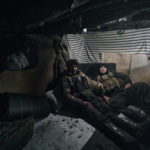 
              Ukrainian soldiers have a rest in their shelter near Bakhmut, Donetsk region, Ukraine, Sunday, Nov. 20, 2022. (AP Photo/LIBKOS)
            