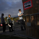 
              People wait in line to vote at a polling place Tuesday, Nov. 8, 2022, in Las Vegas. (AP Photo/John Locher)
            