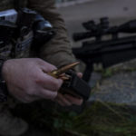 
              Sniper and commander of a unit in the south, alias Kurt, loads an ammunition magazine during an operation against Russian positions, Kherson region, southern Ukraine, Saturday, Nov. 19, 2022. (AP Photo/Bernat Armangue)
            