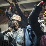 
              Migrants celebrate on the deck of the Rise Above rescue ship run by the German organization Mission Lifeline, in the Mediterranean Sea off the coasts of Sicily, southern Italy, Monday, Nov. 7, 2022. Migrants received the news that the ship is allowed to disembark in the port of Reggio Calabria. (Mission Lifeline Via AP)
            
