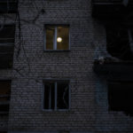 
              A lamp illuminates a room of a recently damaged building during a Russian strike in the southern city of Kherson, Ukraine, Sunday, Nov. 27, 2022. Shelling by Russian forces struck several areas in eastern and southern Ukraine overnight as utility crews continued a scramble to restore power, water and heating following widespread strikes in recent weeks, officials said Sunday. (AP Photo/Bernat Armangue)
            